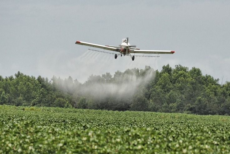 Crop duster spraying pesticidies