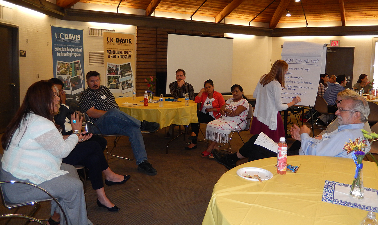 Retreat participants in a breakout group discuss center strategy