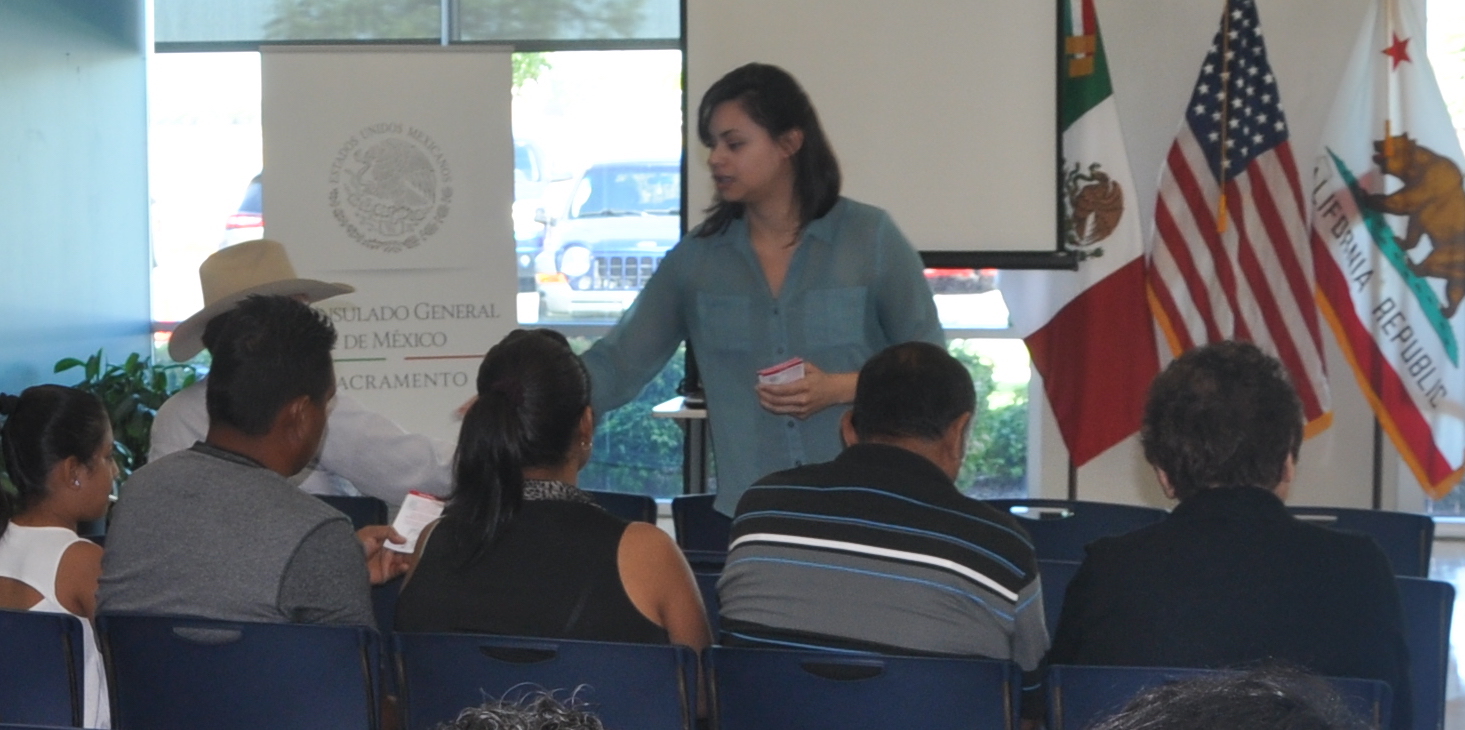 Leslie Olivares interacting with people at the Mexican Consulate