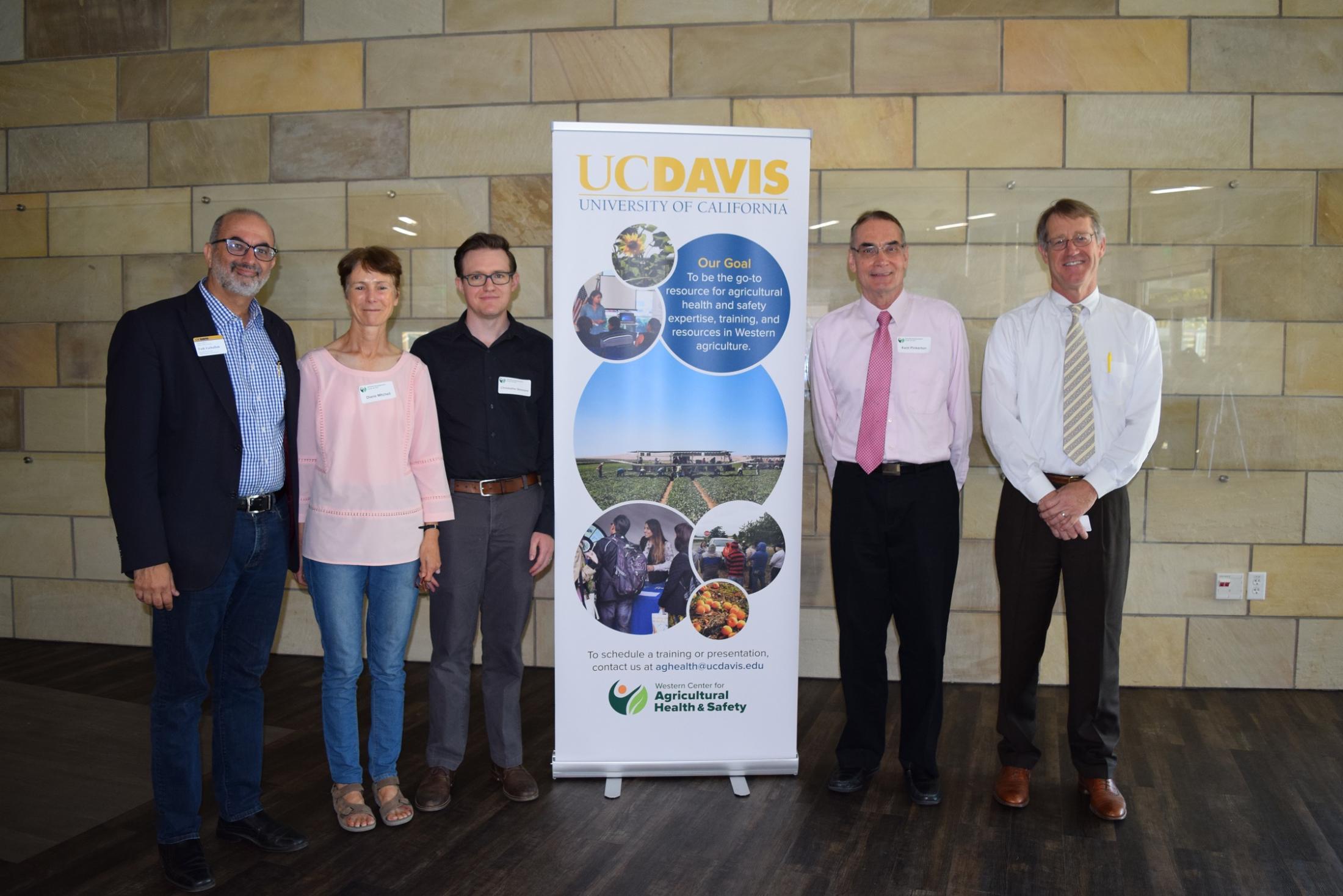 five researchers standing for picture