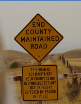 Road Signs "End County Maintained Road" "This road is not maintained Yolo county is not responsible for any loss or injury suffered by reason of its use"
