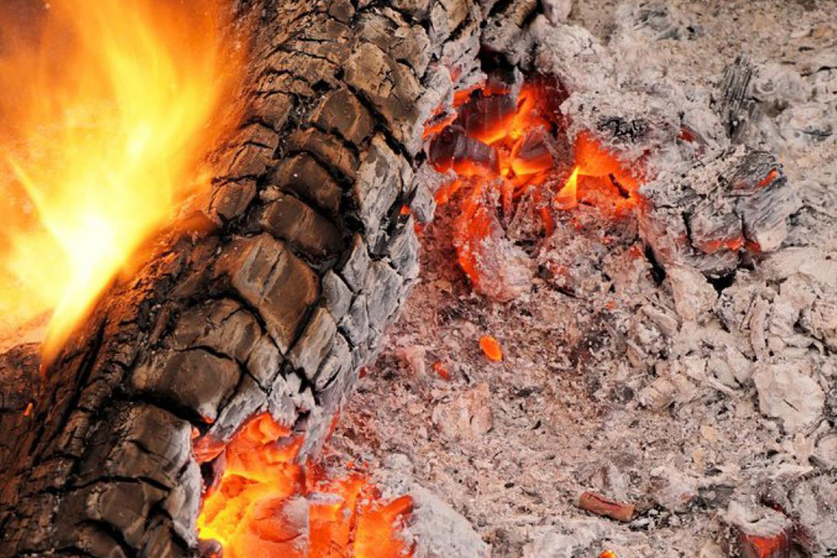 Burning log with ash